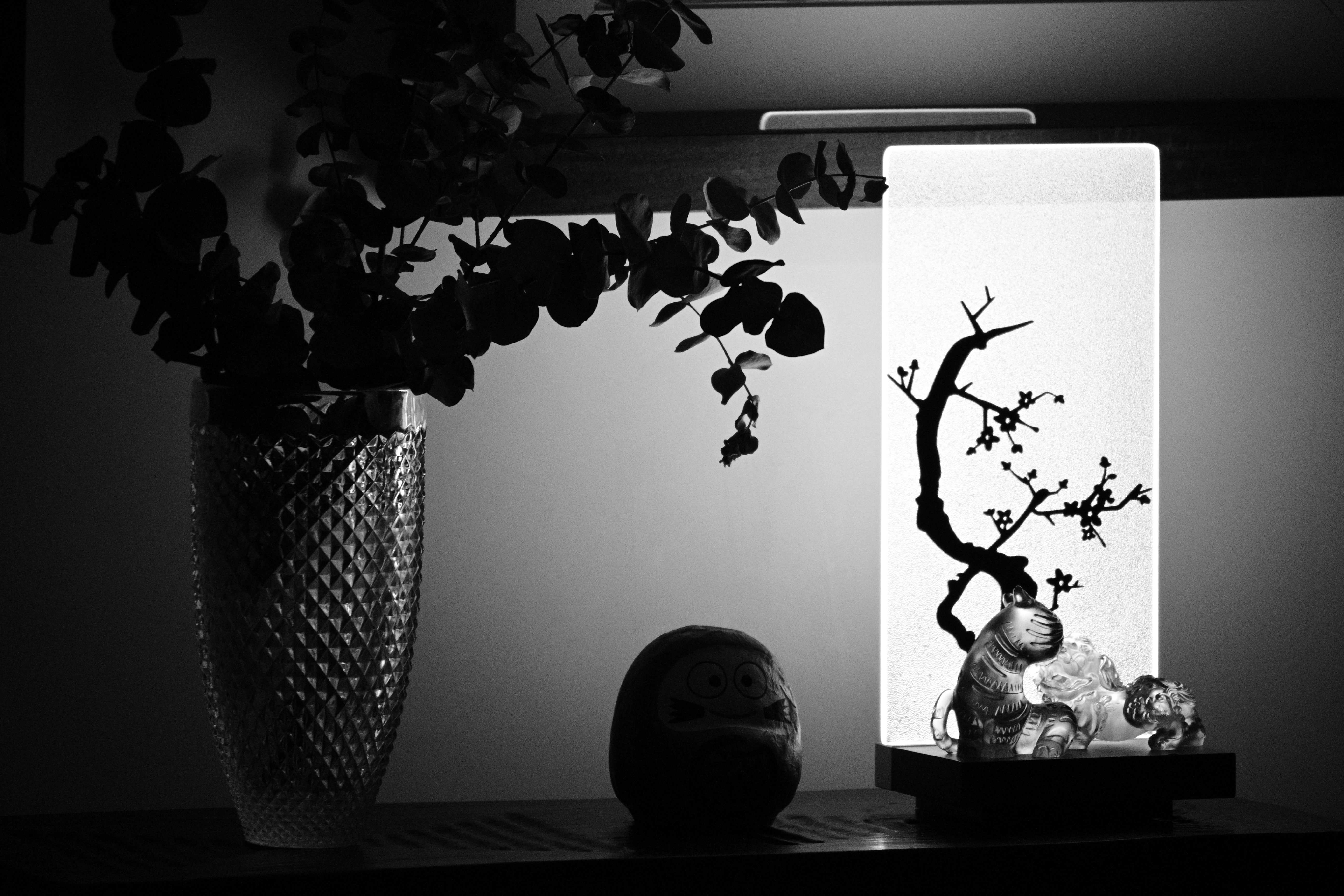grayscale photo of plant in vase